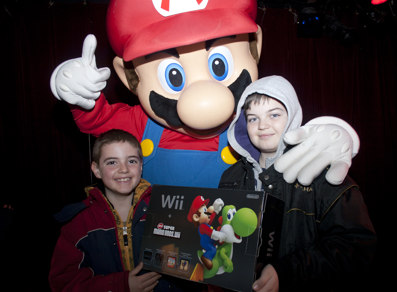 This happy fan was the first to win a Mario Party TM 9 bundle this past weekend at the Mario Party 9 Launch Party. Loyal fans, young and old, partied with the legendary Nintendo character at the Hard Rock Cafe. 